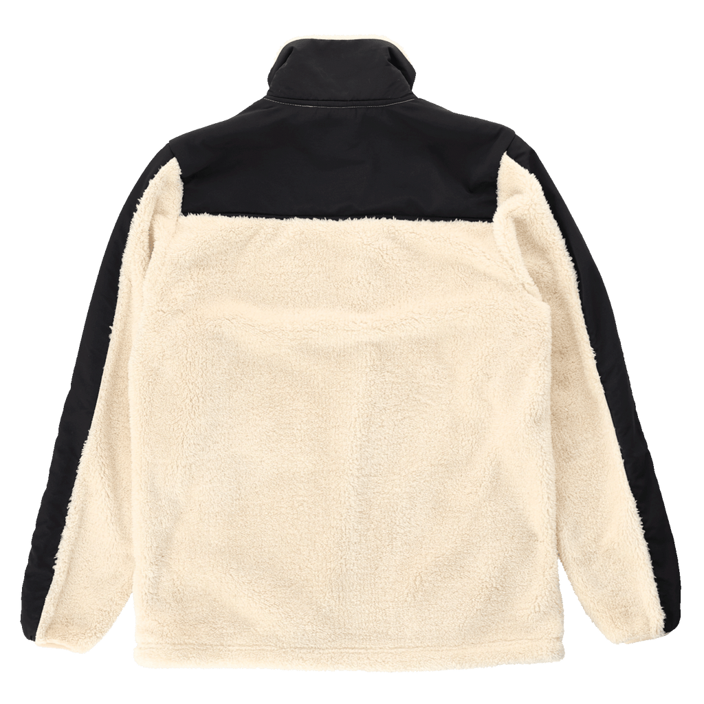 Vue de dos d'une veste polaire en peluche BVB au design « color block ». La veste associe des éléments de couleur crème et noirs pour un look doux et élégant.
