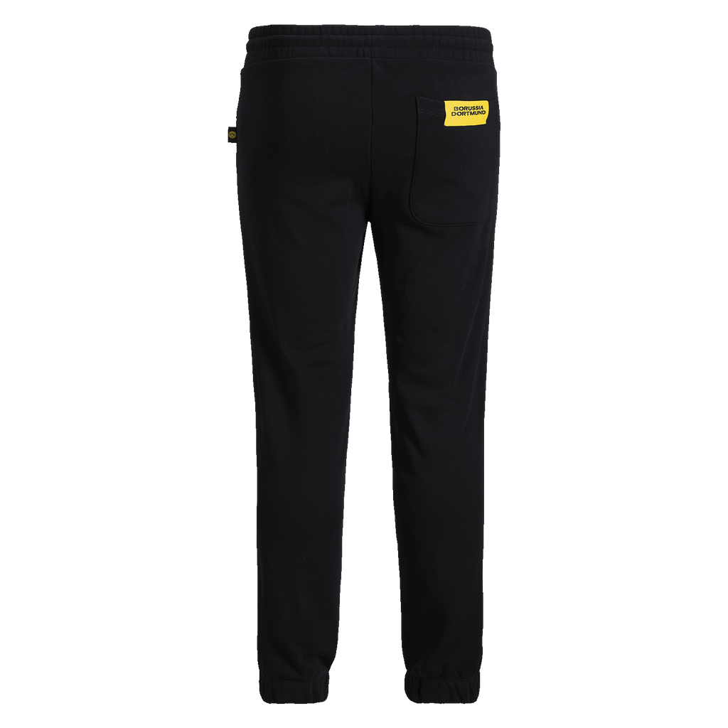 Pantalon de survêtement noir BVB Essentials II avec taille élastiquée, étiquette jaune « Borussia Dortmund » sur la poche arrière et bas de jambe étroit.