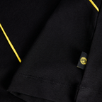 Close-up of a black-and-yellow BVB T-shirt with the BVB logo on a sewn-on label.