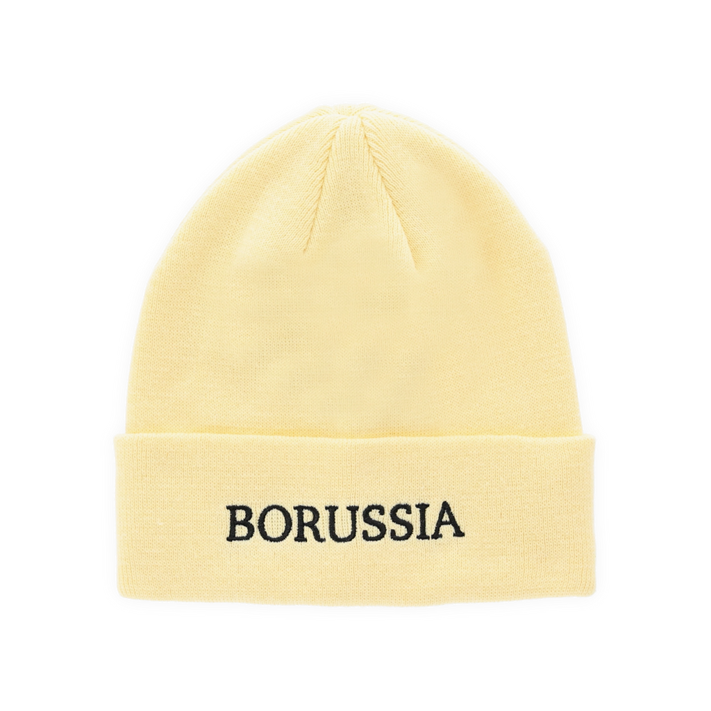 Pastellgelbe BVB-Mütze mit schwarzem ‚Borussia‘ Schriftzug auf der Vorderseite als Fanartikel und Accessoire.