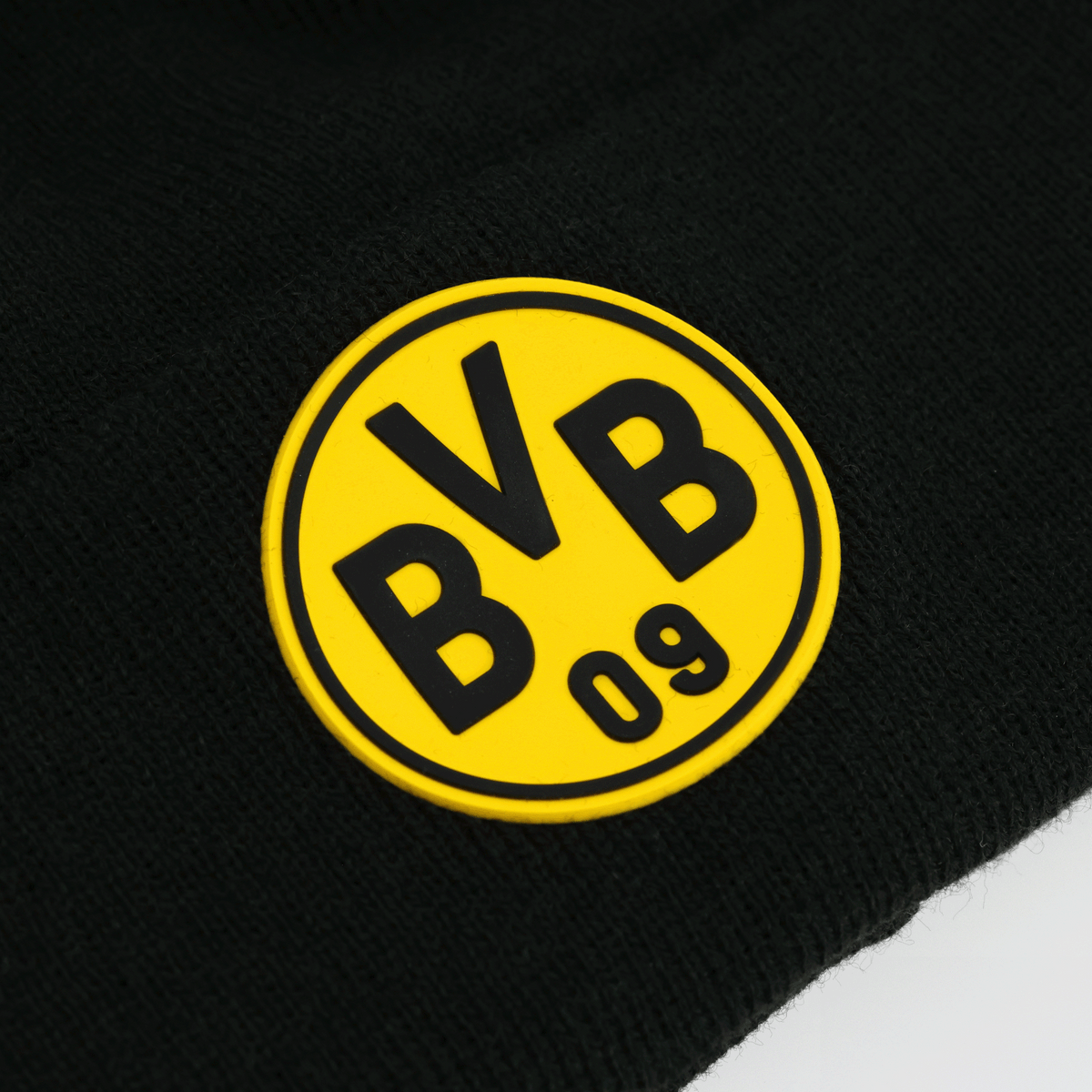 Die schwarze BVB-Bommelmütze von New Era für Kinder, mit gelbem BVB 09-Logo, perfekt für Fans.