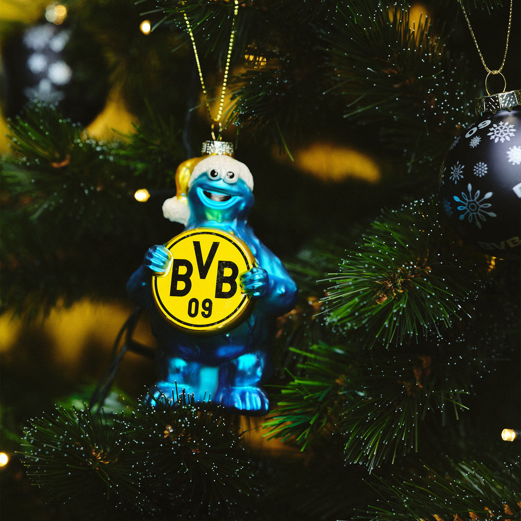 BVB-Weihnachtsanhänger in Form eines blauen Krümelmonsters aus Glas, das ein schwarzgelbes BVB-09-Emblem hält, passend als Baumdekoration oder Fanartikel.