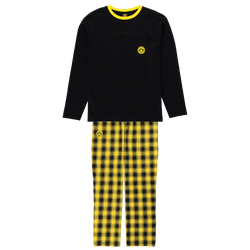 Borussia Dortmund pajamas featuring a long-sleeved black top and black-and-yellow plaid pants, with the BVB logo on the chest and pant leg.