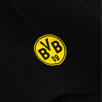 Maglietta nera del BVB con il logo circolare giallo “BVB 09” sul davanti, articolo per i tifosi del Borussia Dortmund.