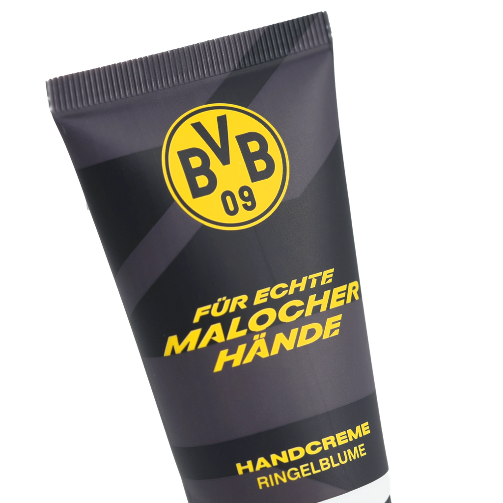 Tubo negro de crema de manos del BVB con el logotipo amarillo del BVB y las inscripciones «Para manos de auténticos trabajadores» y «Crema de manos de caléndula».