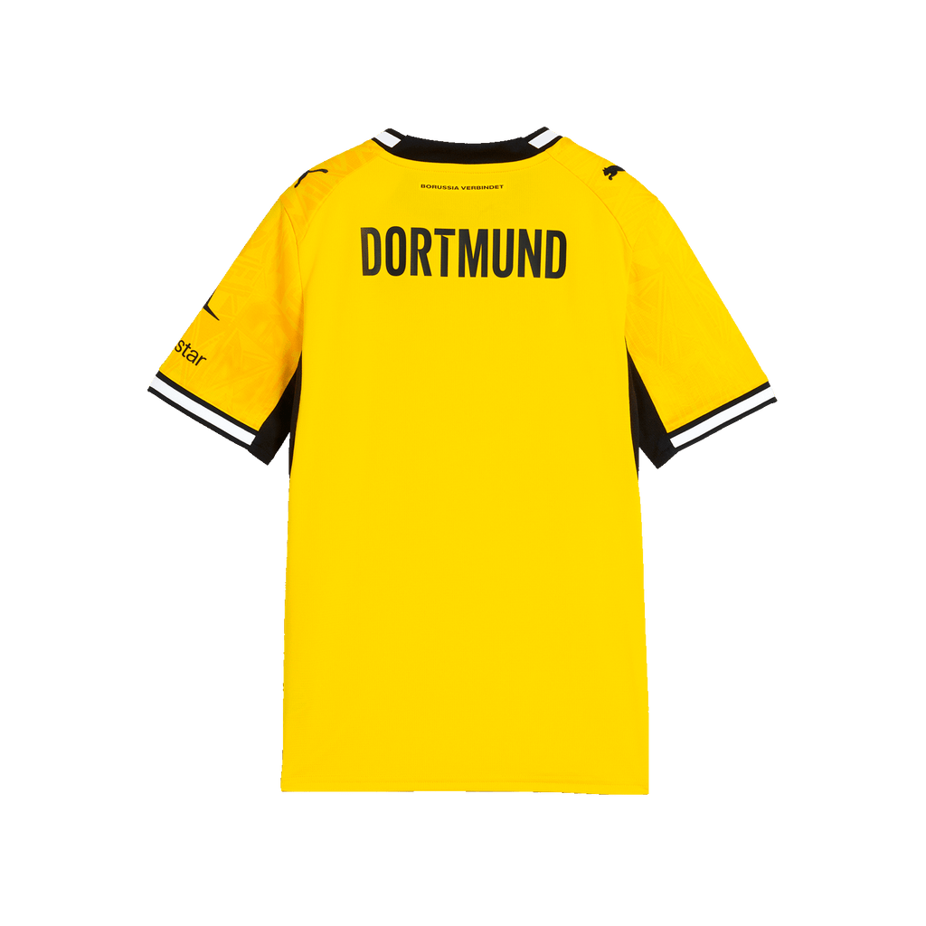La camiseta de local del BVB de la temporada 26-27 para niños, en negro y amarillo; vista trasera con la inscripción «DORTMUND» en la espalda y el logotipo de PUMA en las mangas.