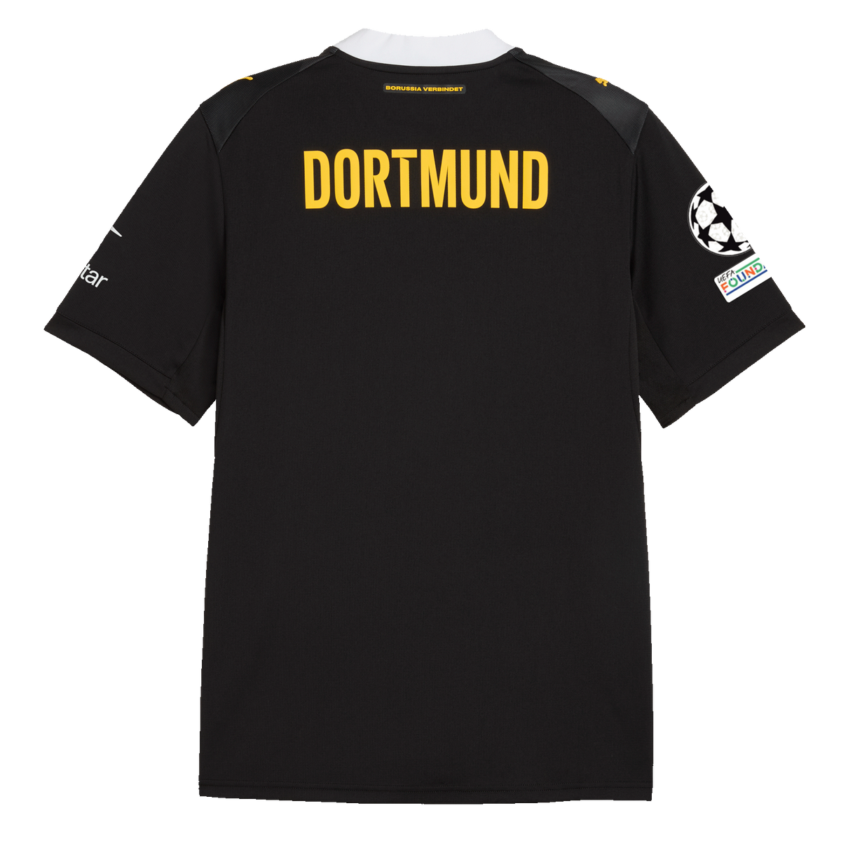 La camiseta de visitante del BVB para la temporada 2026/27, en negro y amarillo, vista desde atrás con la llamativa inscripción «DORTMUND» y el emblema de la Fundación UEFA en la manga.