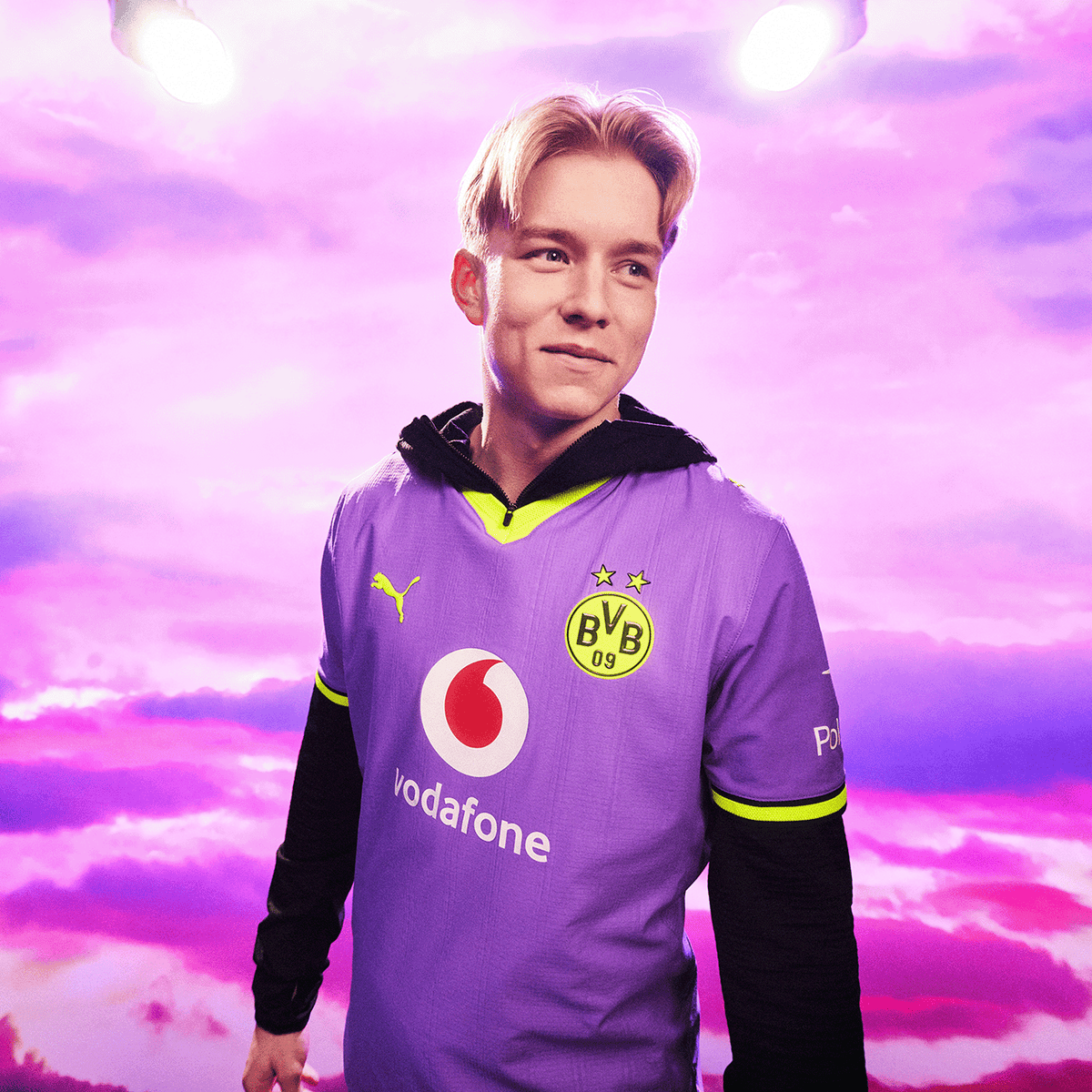 The 2026–27 purple BVB away jersey with yellow accents, the BVB crest, the PUMA logo, and the Vodafone and Polestar logos, set against a violet sky.