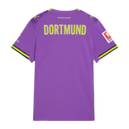 The image shows the purple BVB women's alternate jersey for the 2026–2027 season from the back, featuring yellow "DORTMUND" lettering and visible sponsor logos.