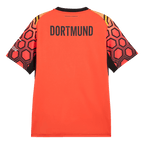Rear view of the red BVB goalkeeper jersey from the 26-27 season, featuring a black collar, “DORTMUND” lettering, and a hexagon pattern on the sleeves.