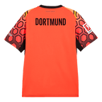 Red BVB goalkeeper jersey 26-27, back view, featuring "DORTMUND" lettering, a dynamic design on the sleeves, and the Bundesliga logo.