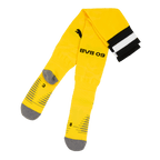 Gelbe BVB 09 Fußballstutzen mit schwarzgelben Details und grauen Verstärkungen im Fußbereich, ideal für Fans und Spieler.