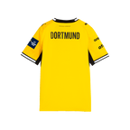 La maglia gialla da casa del BVB 2026/2027 per bambini vista da dietro, con dettagli neri, la scritta “DORTMUND” e la toppa della Champions League.