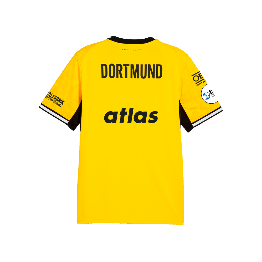 La camiseta de local del BVB de la temporada 26-27 para niños, en negro y amarillo, vista desde atrás con la inscripción «DORTMUND», los logotipos de los patrocinadores y «atlas».