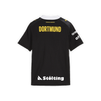 Das BVB-Auswärtstrikot 26/27 für Kinder in schwarz mit gelbem Dortmund-Schriftzug auf der Rückseite und weißen Sponsorenlogos, geeignet für Handballfans.