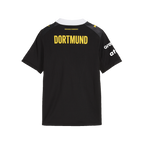 La maglia da trasferta del BVB 26/27 per bambini, di colore nero con la scritta “Dortmund” in giallo sul retro e i loghi degli sponsor in bianco, ideale per gli appassionati di pallamano.