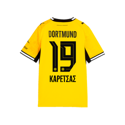 Vue arrière du maillot domicile du BVB 26-27, noir et jaune, pour enfants, avec l'inscription « DORTMUND », le numéro 19 et le nom « Karetsas » en caractères grecs.